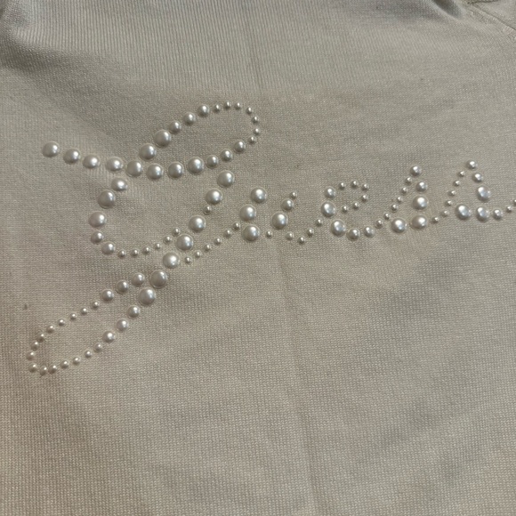 Guess Women’s XS Cold Shoulder. White Faux Pearl Logo Long-Sleeve Top. - Picture 8 of 9